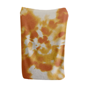 White, orange, and yellow tie dye blanket with a playful vibe