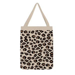 Cream tote bag with black leopard spots and orange accents, wild and fashionable