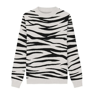White sweater with black tiger stripes for a bold animal-inspired look.