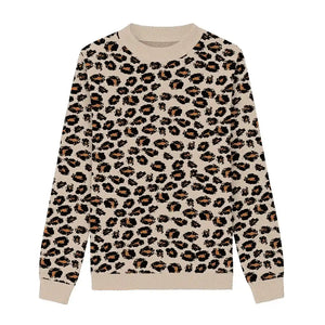 Cream sweater with black leopard spots and subtle orange accents.