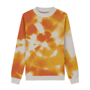 Tie dye sweater with white, yellow, and orange tones for a sunset-inspired look.