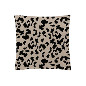 Cream pillow case with black leopard spots, subtle and artistic