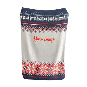 White Christmas blanket with red and navy snowflake motifs
